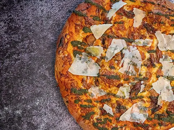 Carson’s Duck Pizza finished with shaved Parmesan and fresh herbs